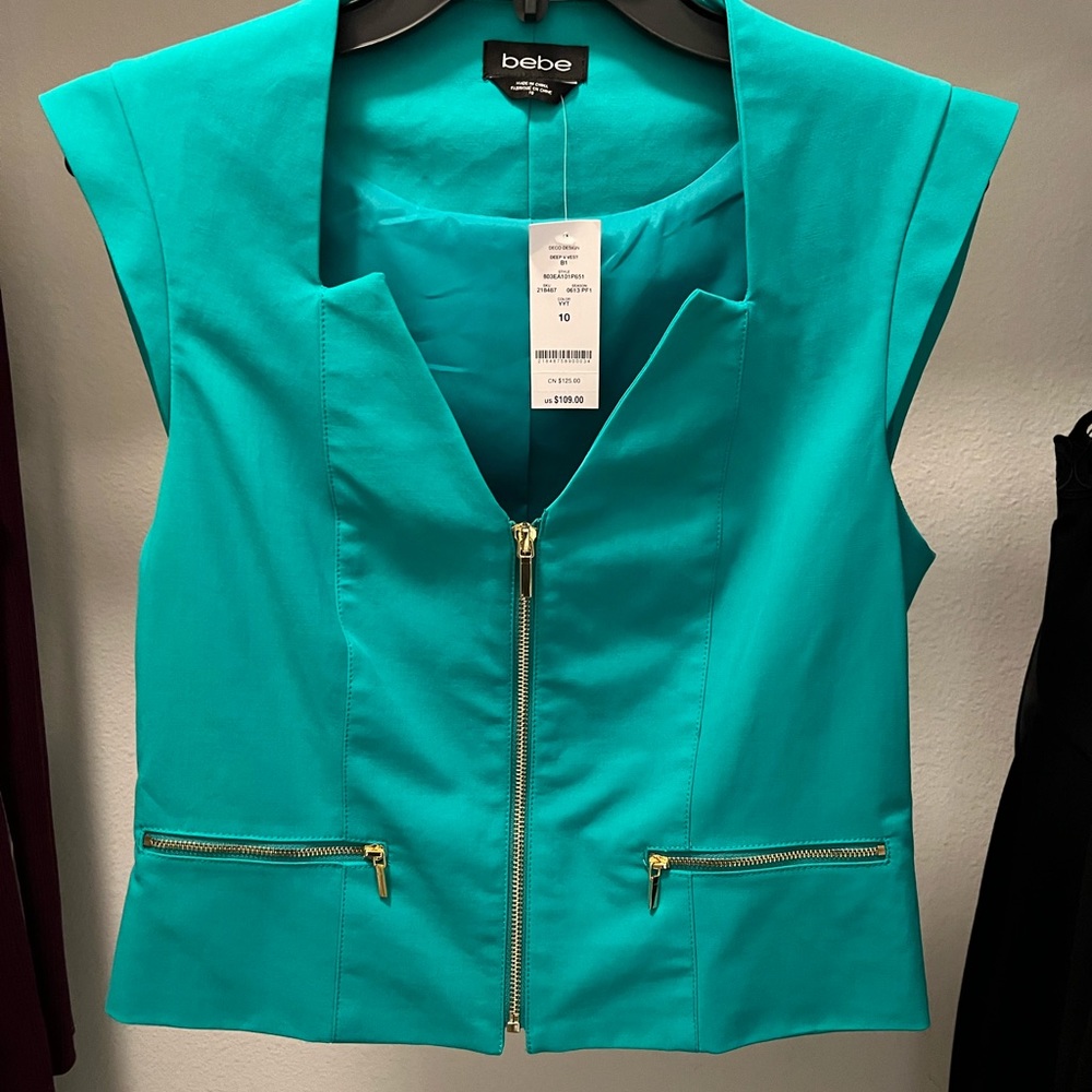 Bebe deep V vest top. Color green with gold zippers. Brand new size10
